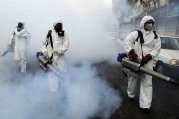  Fire brigade crews wearing protective masks carry out disinfection works in Tehran, Iran to illustrate Iran forces regime critics out of academia