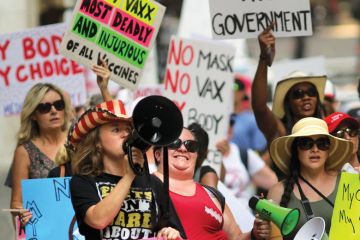 Anti-vaccine and anti-mask mandate protesters shouting holding banners in Massachusetts as Biden threatens to withhold funding from colleges over vaccines
