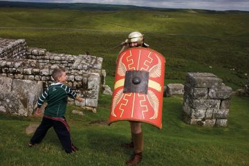 Re-enactment soldier at Housesteads Fort on Roman Hadrian's Wall, to illustrate Universities shun school mentoring ‘to guard global reputation’