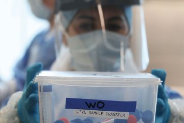 Live samples are held in a container during the opening of the new Covid-19 testing lab to illustrate UK sector leaders expect ‘striking’ pivot to science research