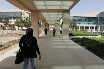 Student walks through campus during her fourth year on scholarship at the American University of Iraq to illustrate Afghan students ‘in doldrums’ at Iraqi university