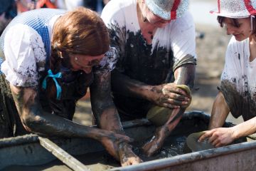 Participants try to wash some of the mud away at the end of the annual Maldon Mud Race in Maldon, Essex Participants try to wash some of the mud away at the end of the annual Maldon Mud Race in Maldon, Essex to illustrate Bid to cut grant administrative burden ‘may have opposite effect’