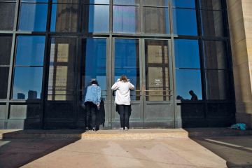 Visitors look inside the closed Philadelphia Museum of Art to illustrate Private US college closures look to gain public attention