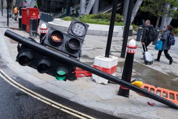 Traffic lights have been knocked over on Leadenhall in the City of London to illustrate International students bear brunt of marking crisis