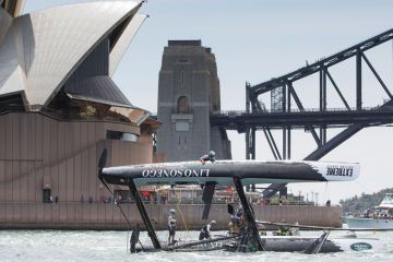 SYDNEY, AUSTRALIA - DECEMBER 11: LINO SONEGO - Team Italia catamaran skippered by Enrico Zennaro (ITA) capsizes after being hit by a gust during racing in Sydney Harbour 