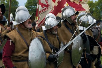 Participants dressed as Spanish army infantry soldiers prepare for battle in the Netherlands to illustrate Irish and Dutch education reforms ‘threaten university autonomy’