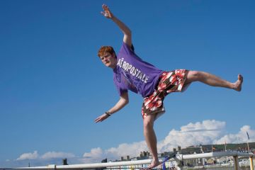 A university college student, on a slack rope balancing to illustrate Business model will ‘soon fail’