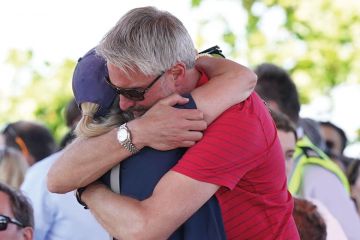  Barnaby Webber's father David embraces Grace O'Malley Kumar's mother ahead of a vigil at the University of Nottingham as the article describes