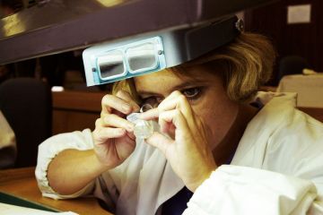  A sorter inspects a 143-carat Russian diamond for France to back not-for-profit diamond journals