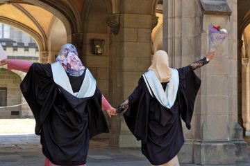 Malaysian students wearing gowns at their Melbourne University graduation Malaysian students wearing gowns at their Melbourne University graduation to illustrate International students ‘becoming happier’ than locals: surveys