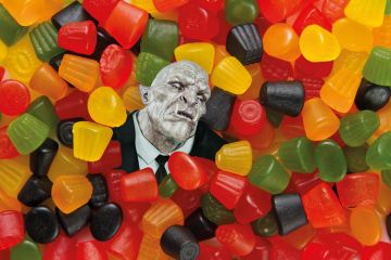 Trolls head surrounded by sweets to illustrate Universities must help scholars targeted by trolls