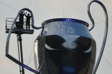Men working on a giant inflatable trophy.