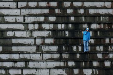 A single spectator waits for the start of an event in Oslo to illustrate Norwegian rectors fear course closures if overseas fees come in