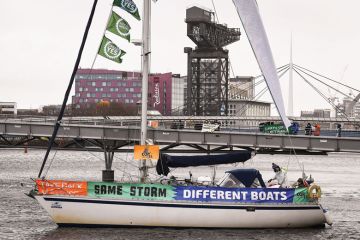 Activists hold a demonstration marking the delayed COP26 UN climate negotiations 