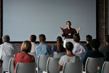 People at a lecture for University leaders more wedded to lectures than before Covid