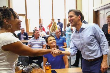 Erica McCray, associate dean meets Ben Sasse, president of the University of Florida to illustrate Ben Sasse wins over Florida faculty with moderation and money