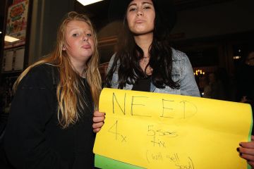 Young fans try to buy tickets for the sold out show to illustrate Australia wrestles with shortage of placements for students