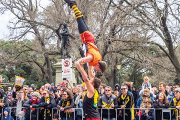 Australian Football League balance on each other to illustrate Regional universities can hold their own, deputy v-c insists