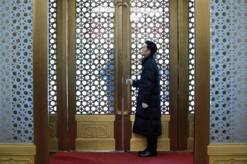 Security personnel stands behind a gate in Beijing, China to illustrate Fears for academia’s ‘peacemaker’ role, as China expertise wanes 