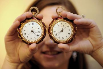 A pair of rare gold pocket watches on display to illustrate A question of timing