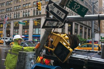 A private contractor helps remove a traffic signpost as a metaphor for Nottingham rapped for ‘misleading’ students over China campus
