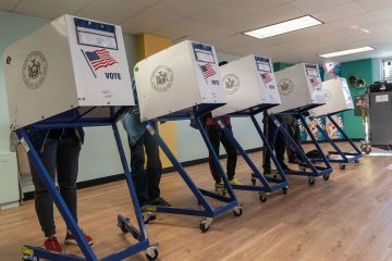  People seen voting at a polling station in the Bronx on election day to illustrate hope for US reforms as student voters make voices heard in midterms