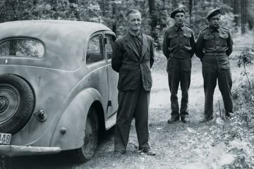William Joyce (Lord Haw-Haw) guarded by soldiers, Germany, 1945 William Joyce (Lord Haw-Haw) guarded by soldiers, Germany, 1945