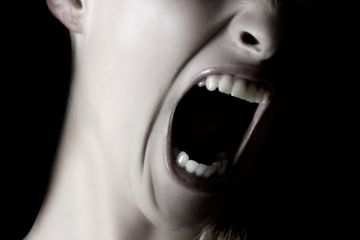 Woman screaming (close-up) Woman screaming (close-up)