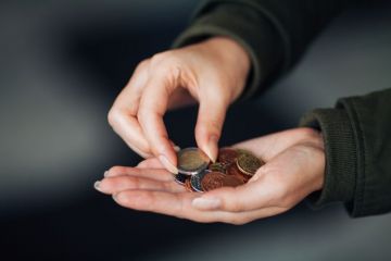 Woman counting euros in hand