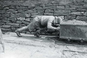worker-pushing-cart