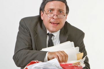 Worried businessman carrying paperwork Worried businessman carrying paperwork