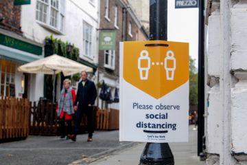 York, UK, England, 24-10-2020, Advisory sign on lamp post in the city Centre advising people observe the social distancing guidelines