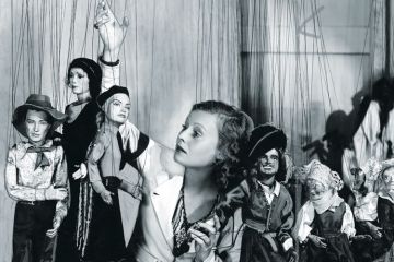 Young woman playing with puppets Young woman playing with puppets
