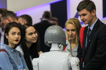 Young people communicate with robot