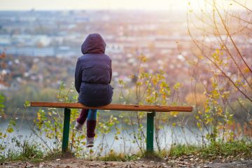 Young woman sitting on bench