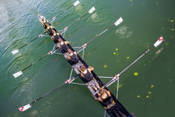 Zagreb, Croatia - September 21, 2014 Young athletes train rowing on the Lake Jarun Zagreb, Croatia - September 21, 2014 Young athletes train rowing on the Lake Jarun