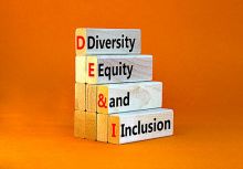 A pile of wooden bricks spelling out DEI A pile of wooden bricks spelling out DEI