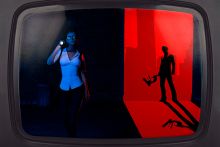 Female detective with ominous man holding microscope, on a television screen. To illustrate scientific sleuthing.