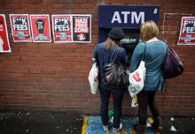 Students arriving for Manchester University's freshers week queue up at a cash machine in Manchester, England.  Students arriving for Manchester University's freshers week queue up at a cash machine in Manchester, England.