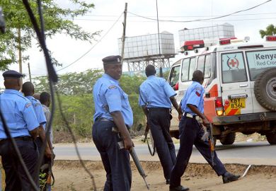 Kenyan police officers take positions outside Garissa University College