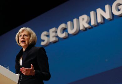 Theresa May speaking at podium Theresa May speaking at podium