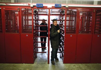 Red entrance_turnstile_two men