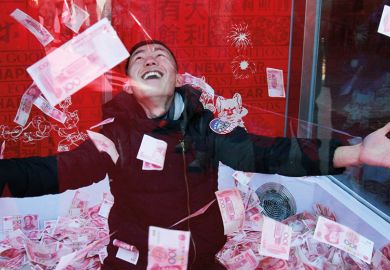 A man surrounded by banknotes