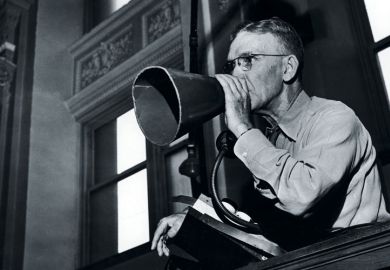 A man using a meaphone A man using a meaphone