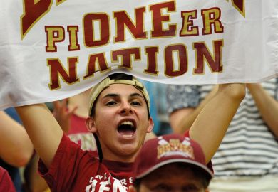 A man holding up a banner