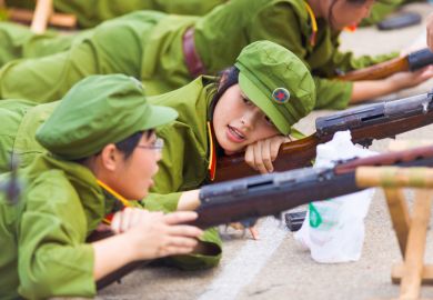 A Chinese female university student during compulsory university military training A Chinese female university student during compulsory university military training