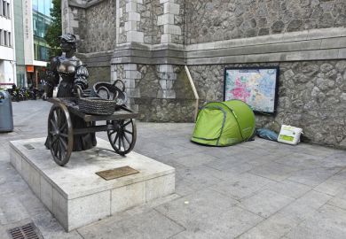 A homeless person's tent beside the iconic Molly Malone bronze statue in Suffock Street, Dublin City Centre