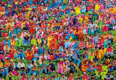 A large group of people wearing colourful clothing A large group of people wearing colourful clothing
