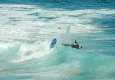 A surfer at the southern end of Bondi Beach gets wiped out while surfing a wave
