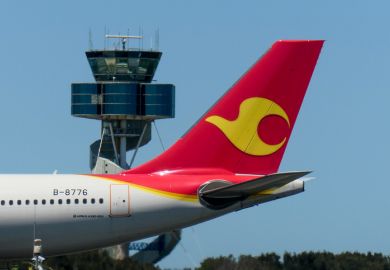 A Tianjin Airlines Airbus A330-243 plane, registration B-8776, has landed from Chongqing as flight GS7943 and taxiing to the international terminal of Sydney Kingsford-Smith Airport. This image was taken from Kyeemagh, Botany Bay, on a hot and sunny after
